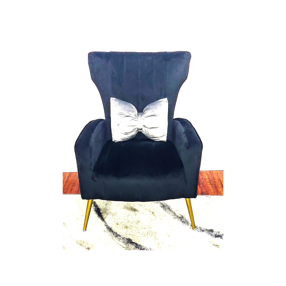 Ash gray bow-shaped velvet throw pillow on modern sofa