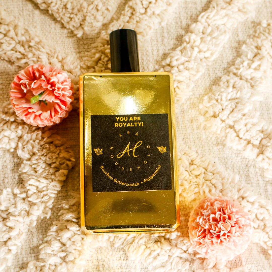 Room and linen spray next to cozy bedroom setting